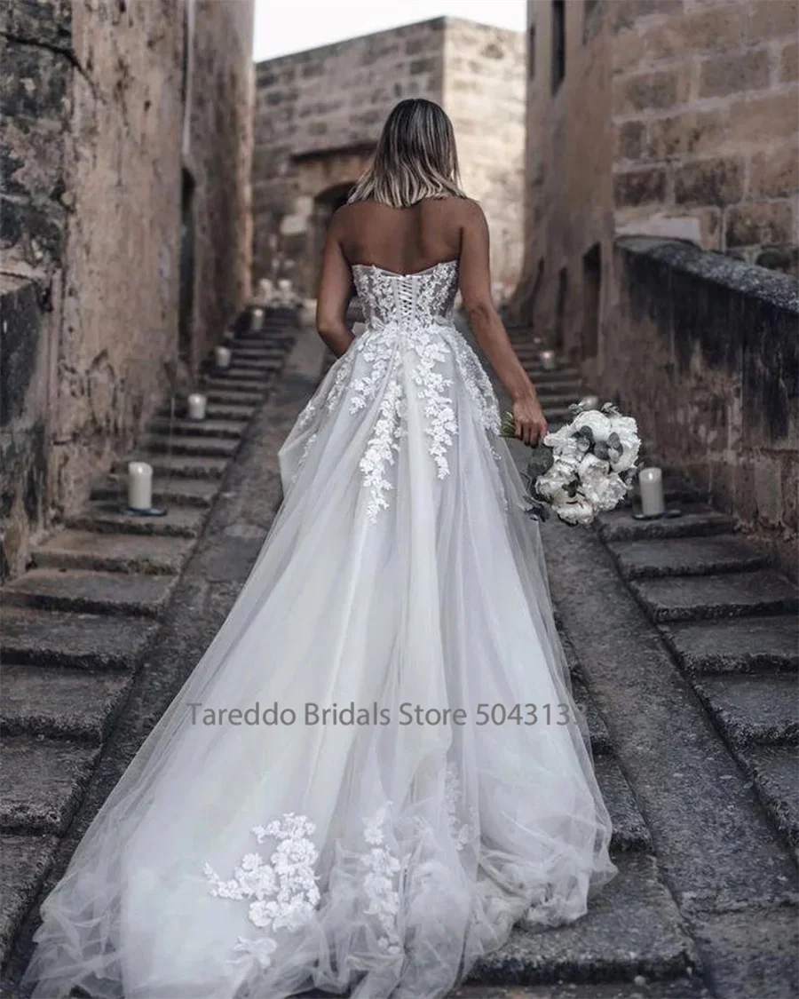 Customized Strapless Wedding Dress Featuring Stunning Crystals Lace Appliques and Flowy  Silhouette Bridal Dress The Clothing Company Sydney