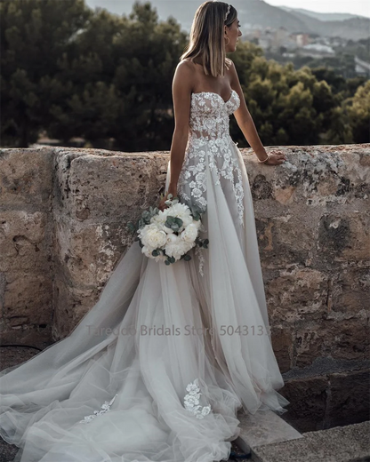 Customized Strapless Wedding Dress Featuring Stunning Crystals Lace Appliques and Flowy  Silhouette Bridal Dress The Clothing Company Sydney